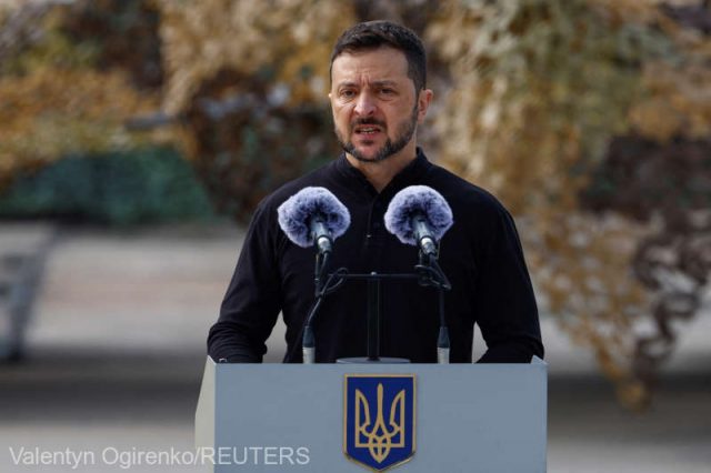 Ukraine's President Zelenskiy speaks next to service members next to F-16 fighting aircrafts during marking the Day of the Ukrainian Air Forces in an undisclosed location in Ukraine